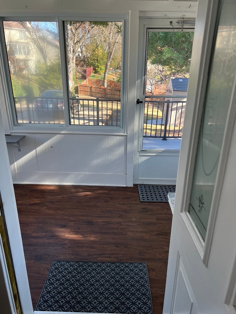 Three season porch off kitchen to deck and parking. 