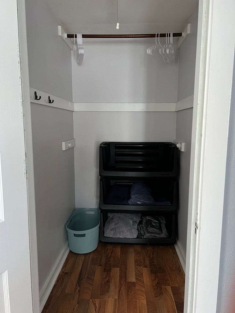 Walk in closet across from bedroom.