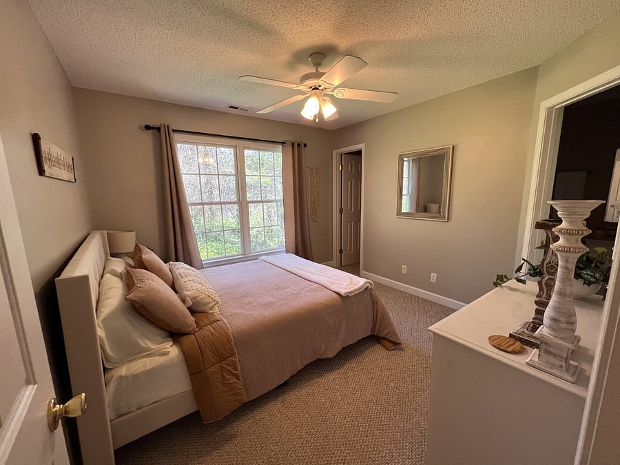 Bedroom #2 with queen bed and walk in closet. Door goes into shared bathroom.
