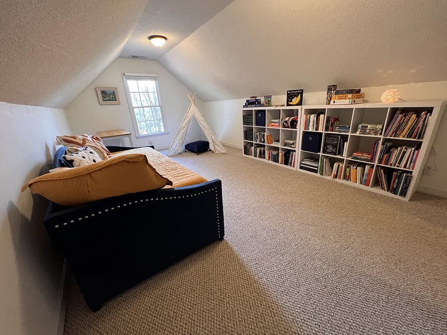 Bedroom #4 is a FROG (front room over garage) with small closet and desk work area. Two twin beds in the trundle bed.