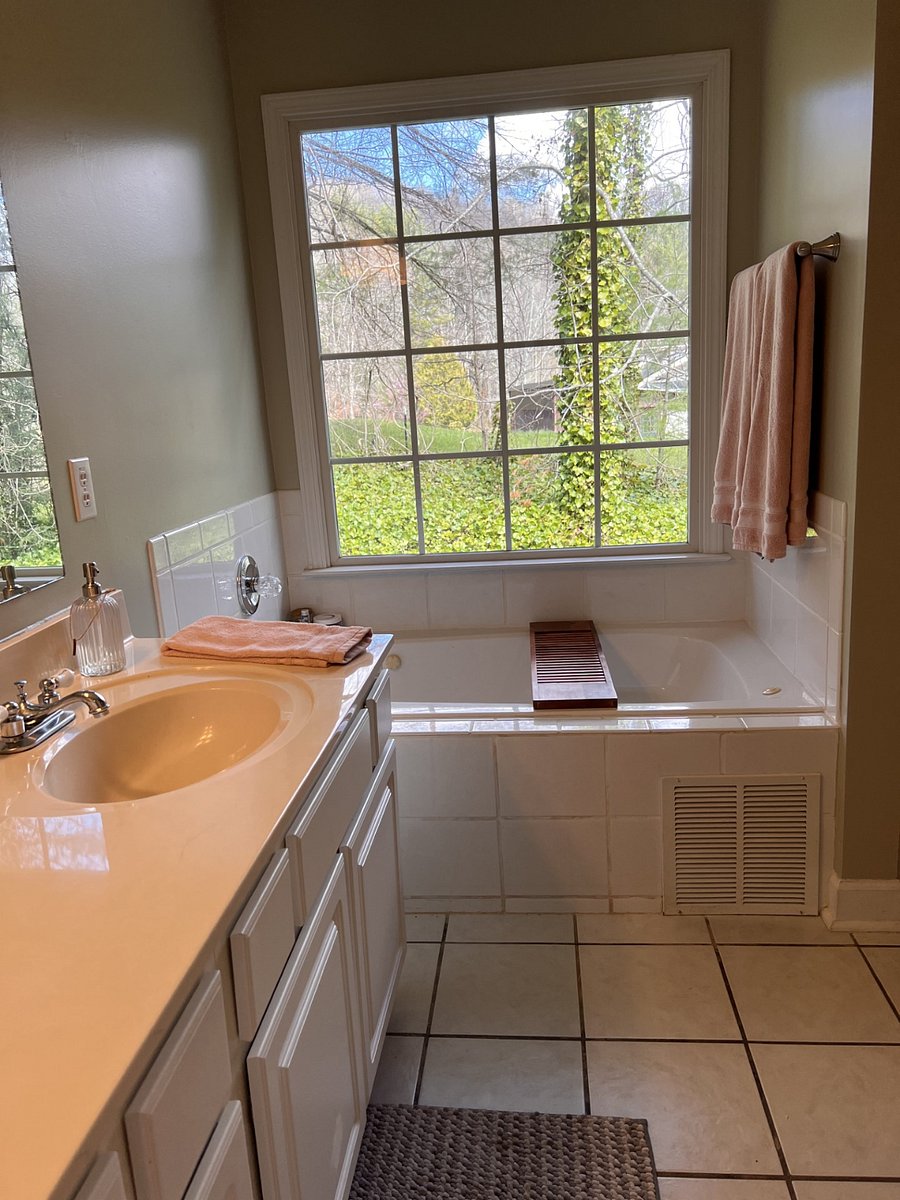 Primary bedroom bathroom with jetted tub and separate shower and walk in closet.