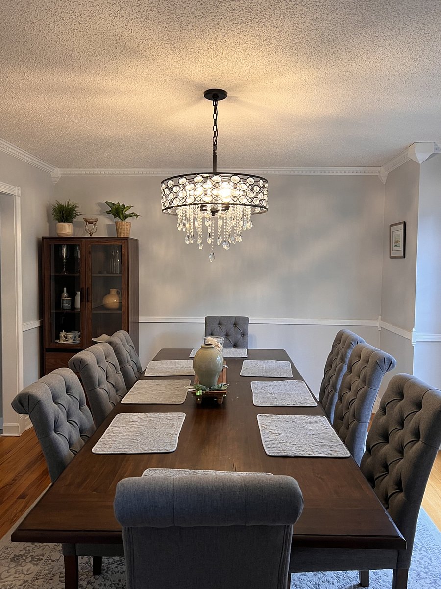 Dining room looks over the front yard. Set up to seat 8 but leaf can be taken out to seat 6.