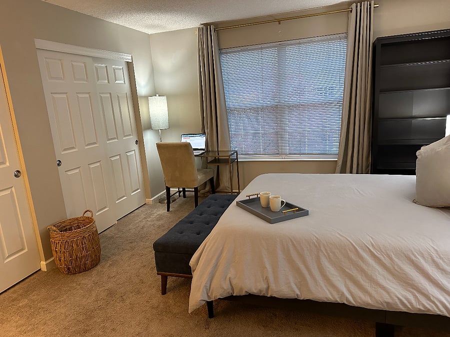 Master bedroom featuring, queen size bed, full size dresser, extra large double closet, desk & chair, and full size book shelf.