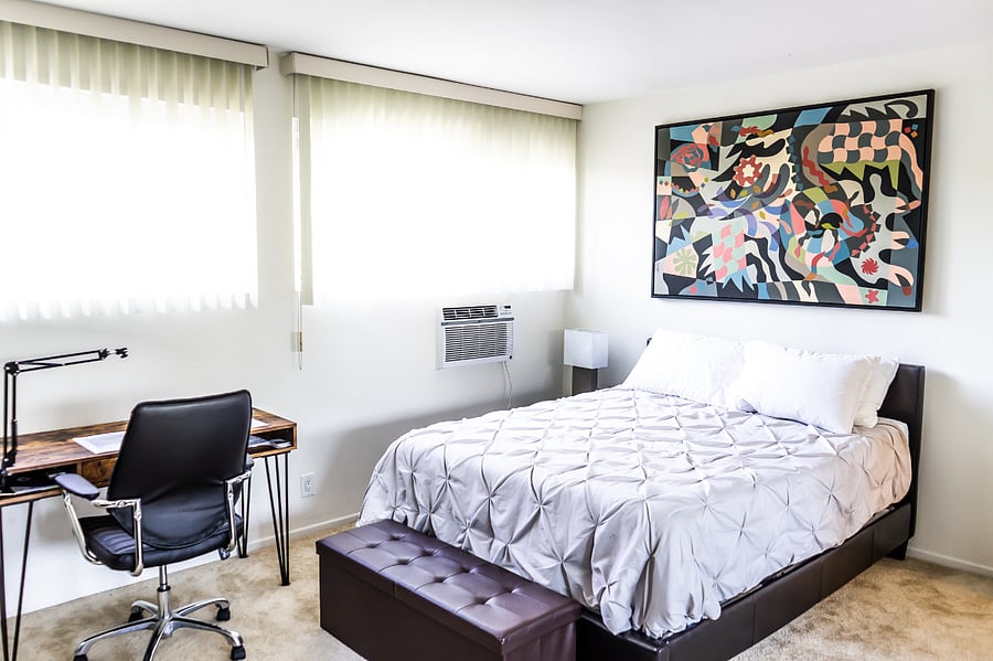 Bedroom with Smart TV, Work Desk, Air-conditioner, closet and drawer space, and Attached Private Bath