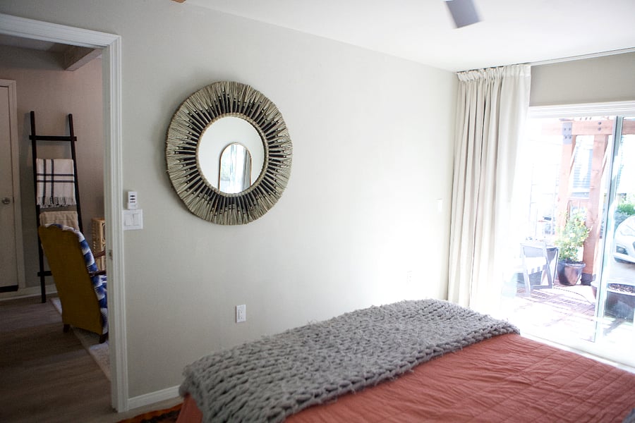 Slider opens from bedroom onto patio with porch swing and fire pit 