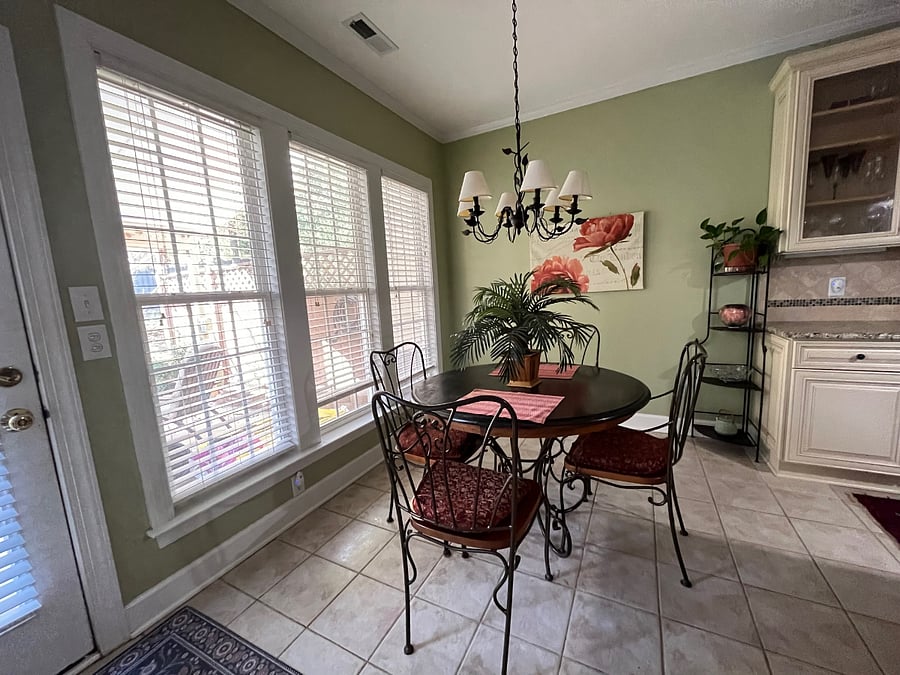 Sunny breakfast nook overlooking the patio and natural area.