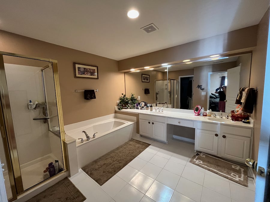 Huge primary bath with garden tub, separate shower and toilet.