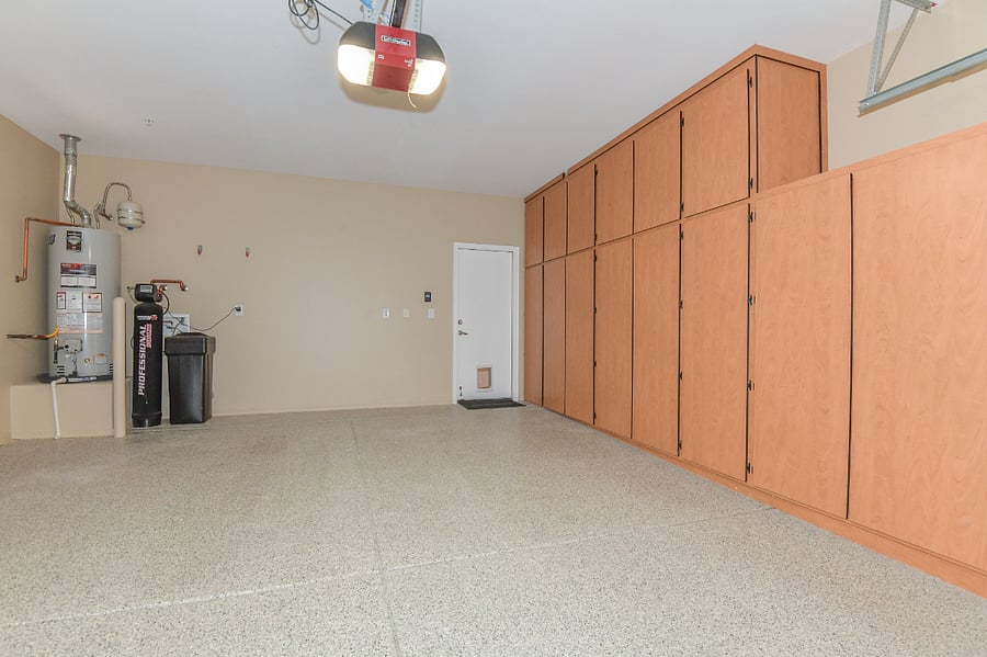 LARGE TWO CAR GARAGE WITH STORAGE CABINETS
