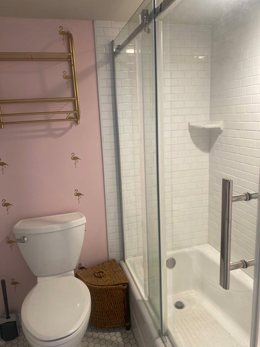 full bath with storage shelves, first aid kit, iron, towels and more!