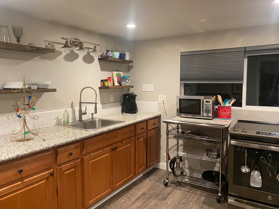 Fully stocked kitchen. window to patio with garden box.
