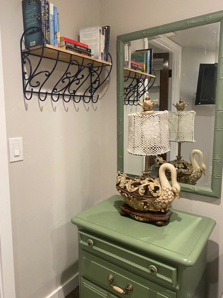 bedroom nightstand, shelf with books