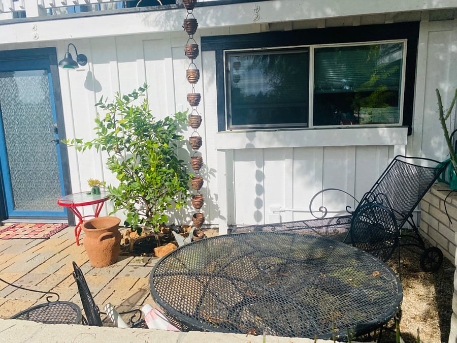 patio entrance with table and chaise lounge