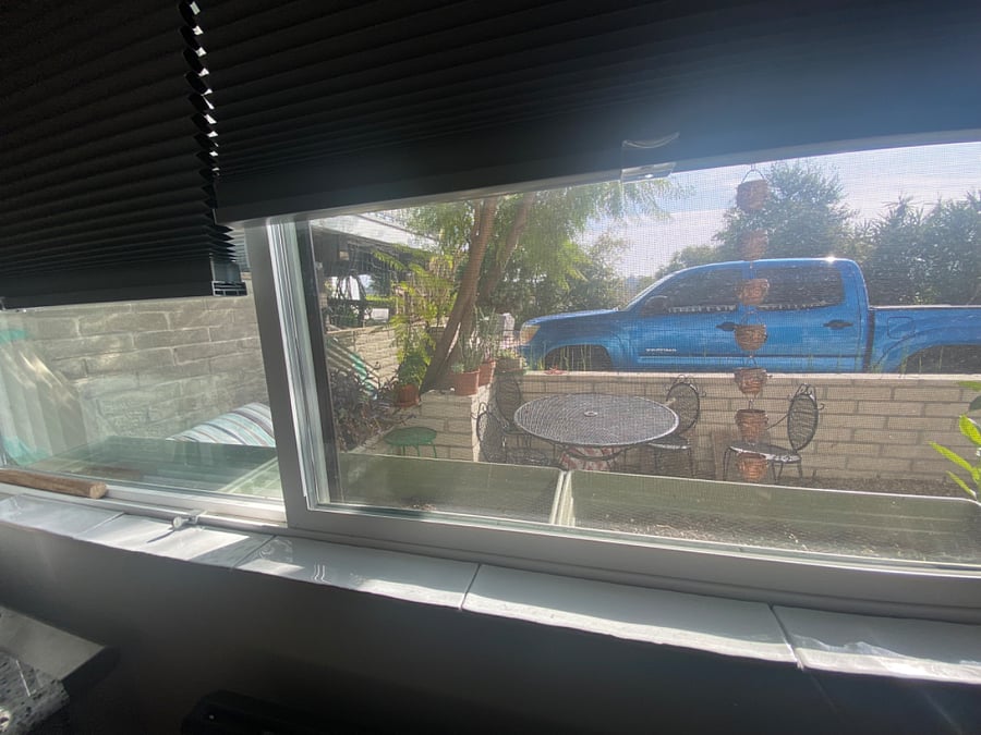 view from kitchen to private patio and parking spot(truck there to demonstrate)