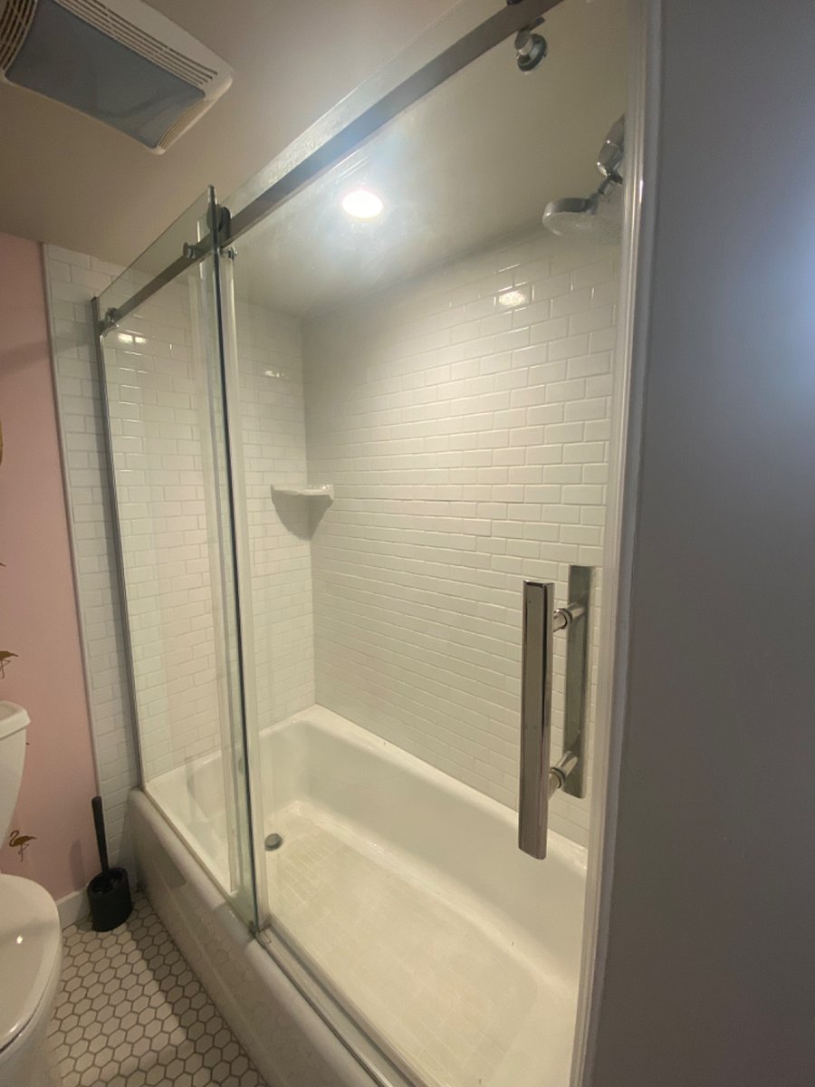 full bath tub/shower. glass enclosure