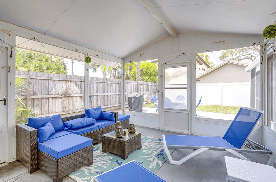 "Spacious screened lanai overlooking the private backyard."