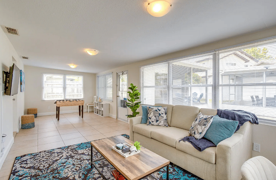 "Bright Florida room with comfortable seating."