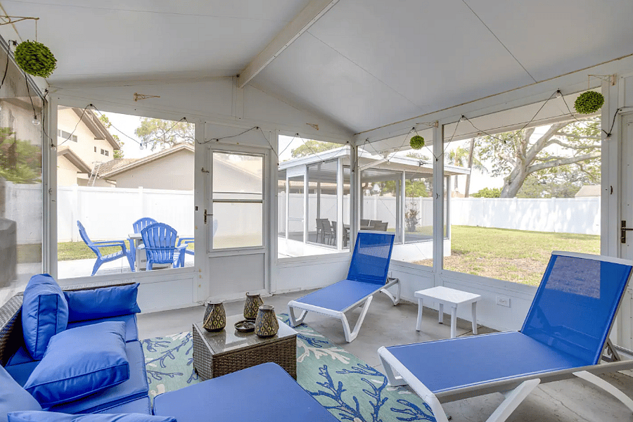 "Spacious screened lanai overlooking the private backyard."