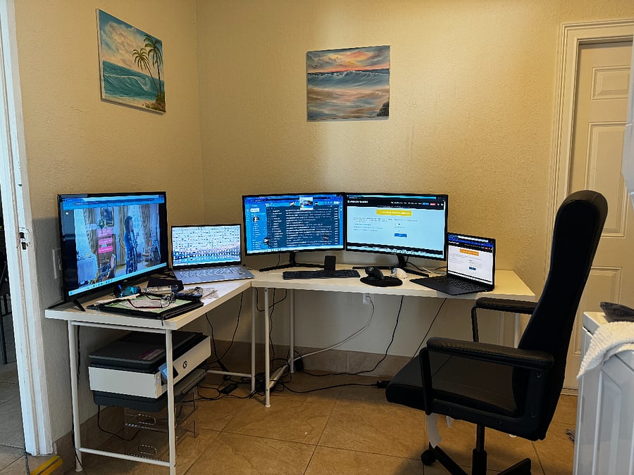 "Dedicated workspace with multiple monitors and high-speed Wi-Fiideal for remote work."