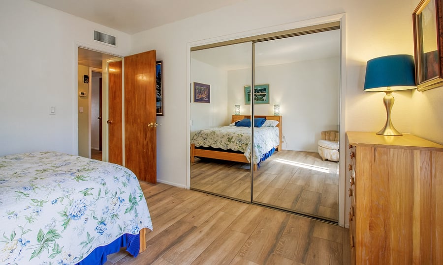 Guest BR with double bed, 2 sliding doors and lots of storage.