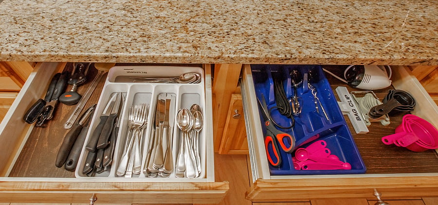 I love showing this picture. Although only a 2 BR house I stock it like you can go a few days filling your dishwasher. I stock the cabinitary the same....lots of plates, cups, etc.