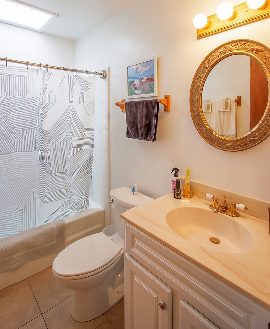 House bathroom w/tub and shower.