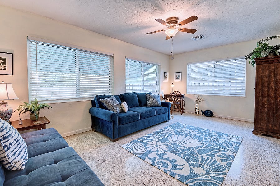 Sunroom - 3rd bedroom for guests. Barn doors for privacy and laundry room and armoire serves as closet.
