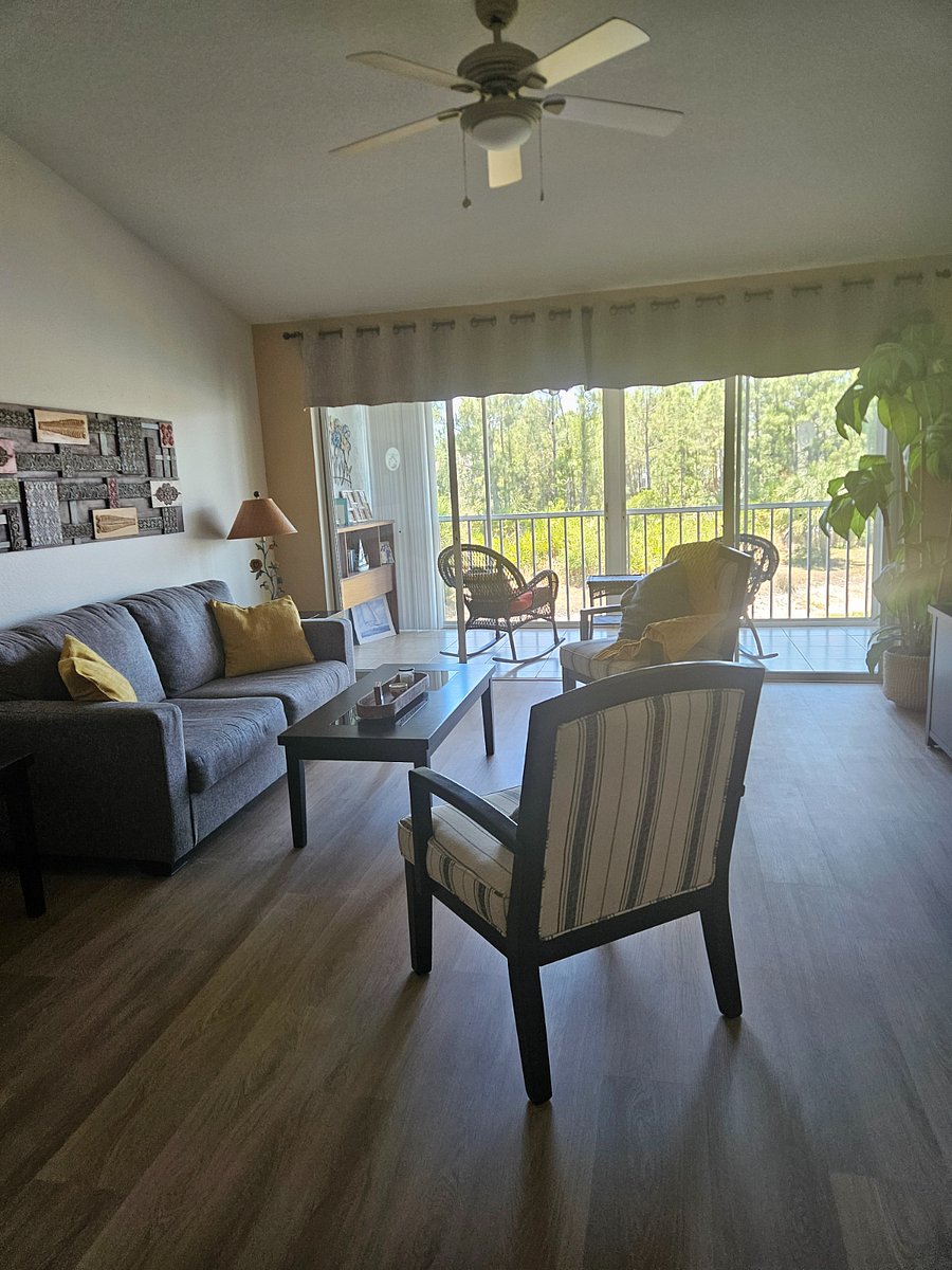 Leaving room and views to the balcony and pond.