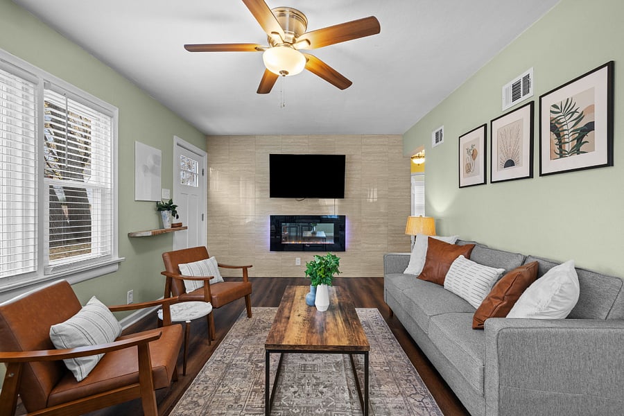 Living room with 55 inch Amazon smart tv, electric fireplace (also heats with a button push), fresh furnishings top to bottom. Tons of natural light in this space. BUT, this home also includes room-darkening blinds in every window for those days you'd rather just shut the world out. 