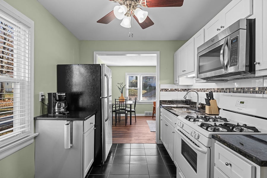 Galley kitchen includes crockpot, air fryer, toaster, coffee maker, and other appliances.