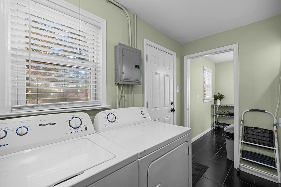 Laundry room. Comes stocked with soap and dryer sheets. Back door in view opens to a cozy (Well, ok, that actually means small here) deck.
