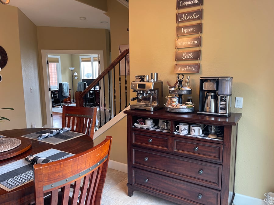 Coffee bar with professional espresso machine and drip coffee maker.