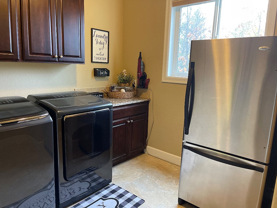 Full access to laundry area with large sized washer and dryer.