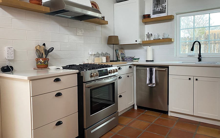 Full kitchen including dishwasher, microwave, and air-fryer/toaster.