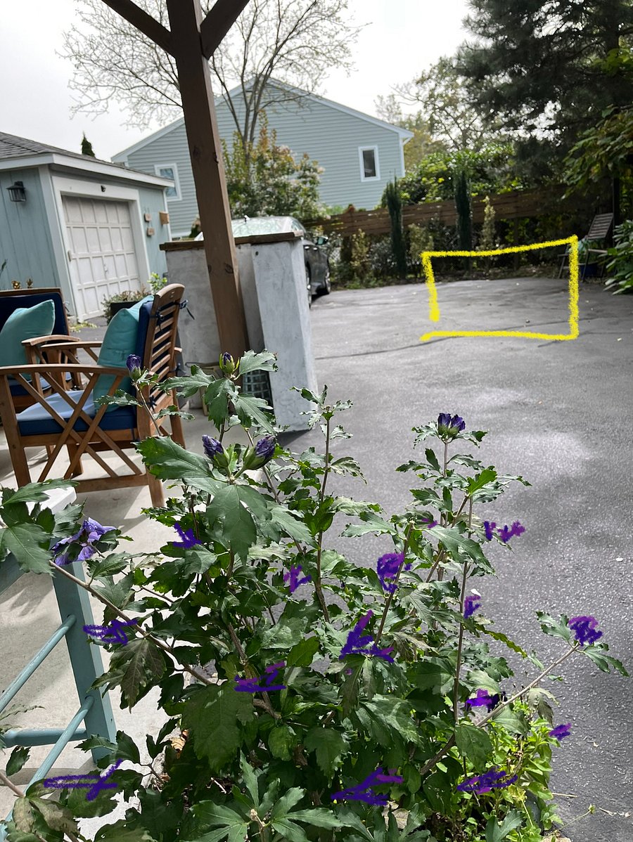 There is space for one mid-size car at the end of the driveway where the yellow box is drawn. Two cars total are parked at the end of the driveway.