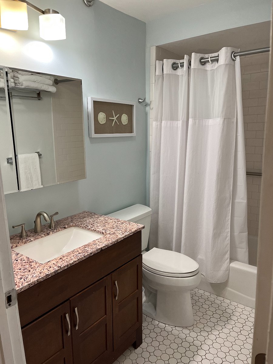 Full bath with tub and shower.