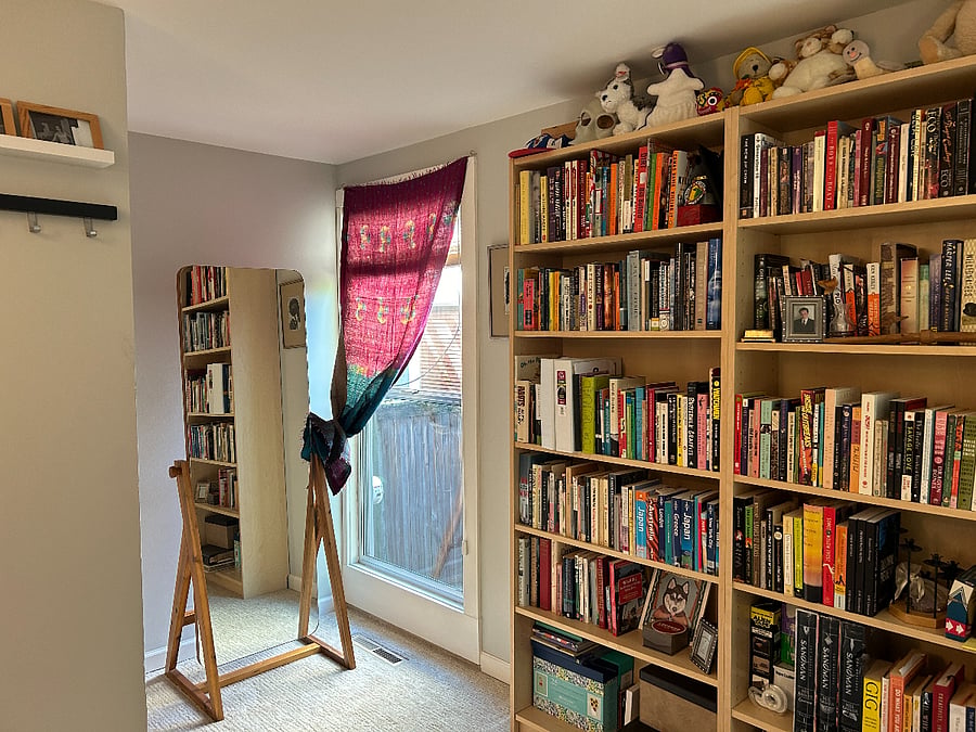 Second bedroom with double bed and full sized mirror