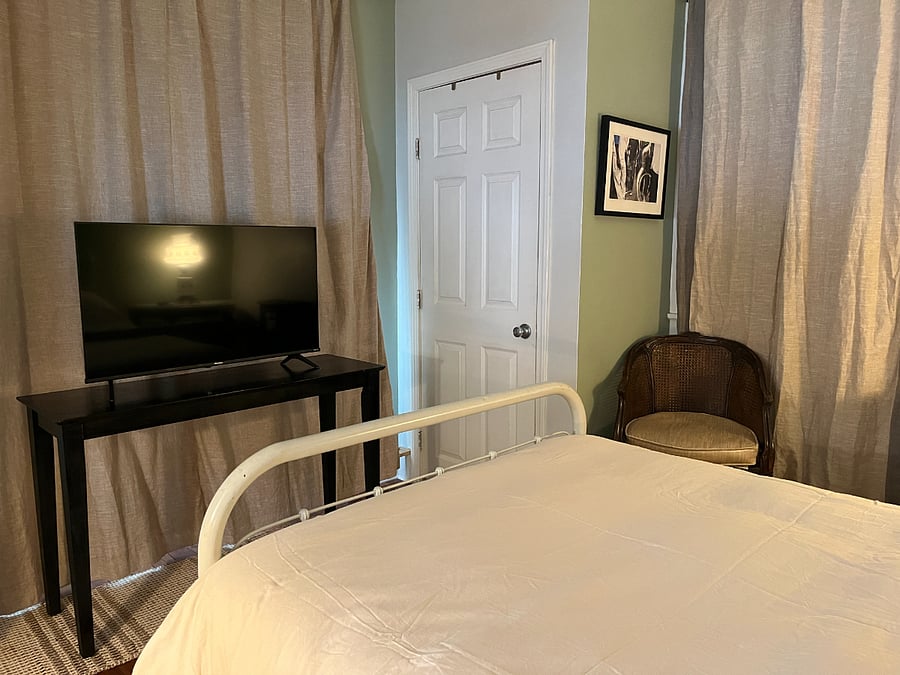 BEDROOM w/ 2 closet space and smart tv.