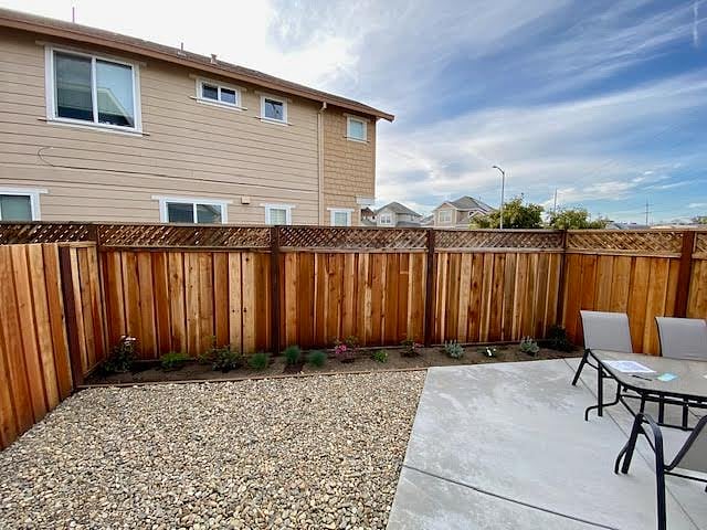 View of the yard while standing outside the bedroom window.