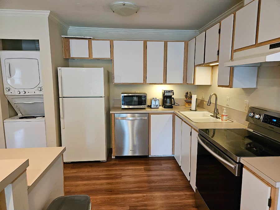 Full kitchen with plenty of counter space. Washer and dryer in unit.
