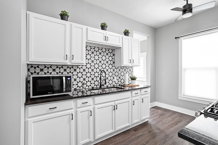 Beautiful farmhouse style kitchen with all of the essentials; cooking utensils, oil, salt and pepper, etc.