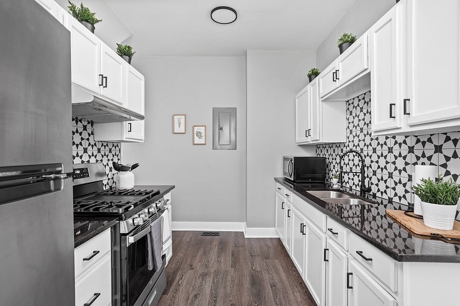 Beautiful modern kitchen with all of the essentials; cooking utensils, oil, salt and pepper, etc.