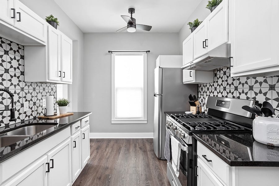 Beautiful farmhouse style kitchen with all of the essentials; cooking utensils, oil, salt and pepper, etc