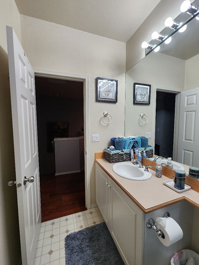 Upstairs bathroom vanity, with the hallway in the background