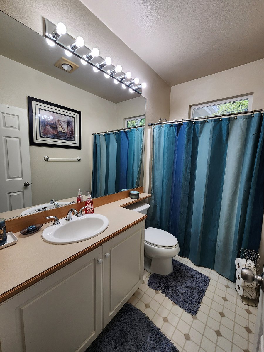 Upstairs bathroom has a shower / tub combination 