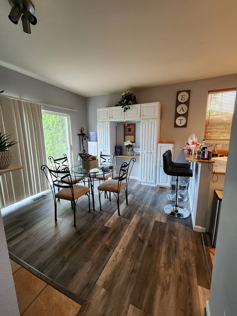 Relaxing breakfast area with a view into the kitchen is located next to the dual sided fireplace