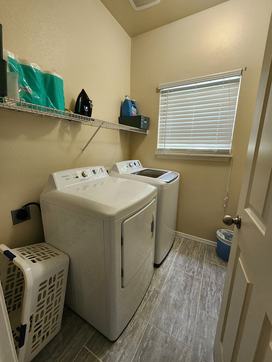 Newly remodeled laundry room with brand new washer and dryer 