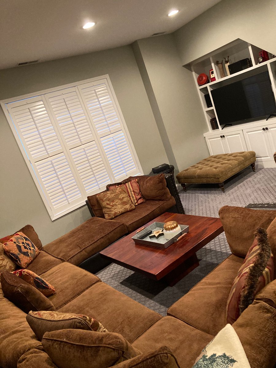 Upon entering the home, youll have access to this lovely bonus room w/Arhaus comfy couch, large TV. The bar area is on the opposite side of room. 