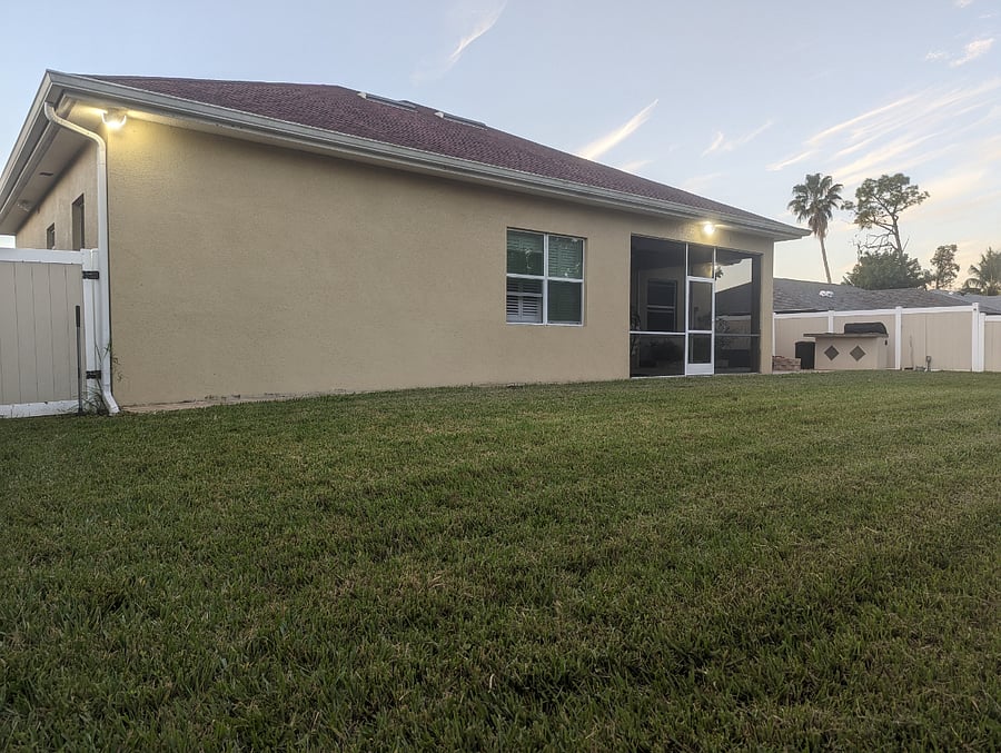 Large backyard with privacy fence.