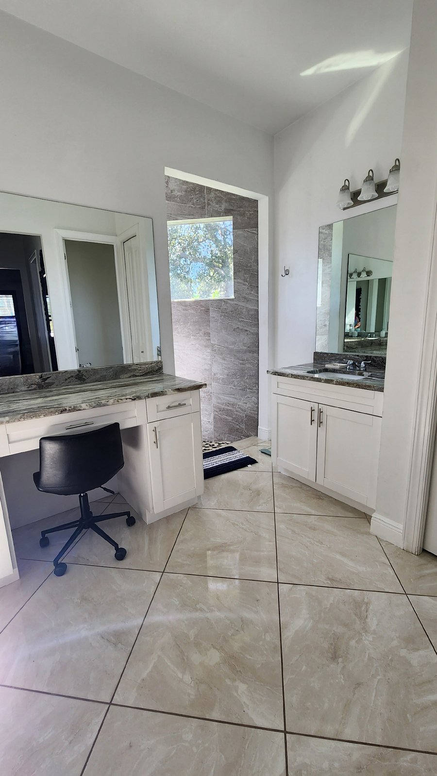 Master Vanity. Master shower accessible on either side.