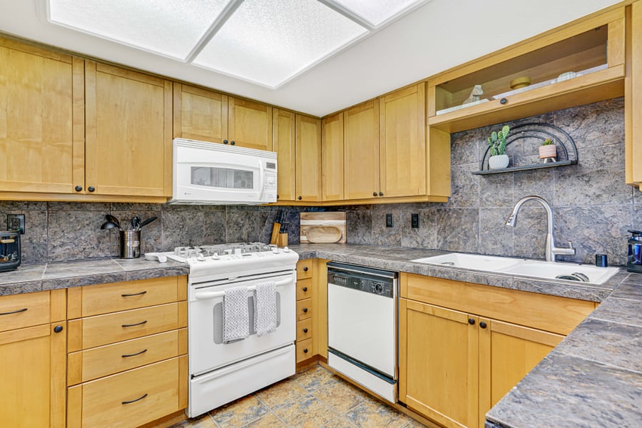 Full-size kitchen with all the necessities including dishes, pots, pans, stemware, baking supplies, cooking utensils, serving dishes, toaster, crock-pot and blender.
